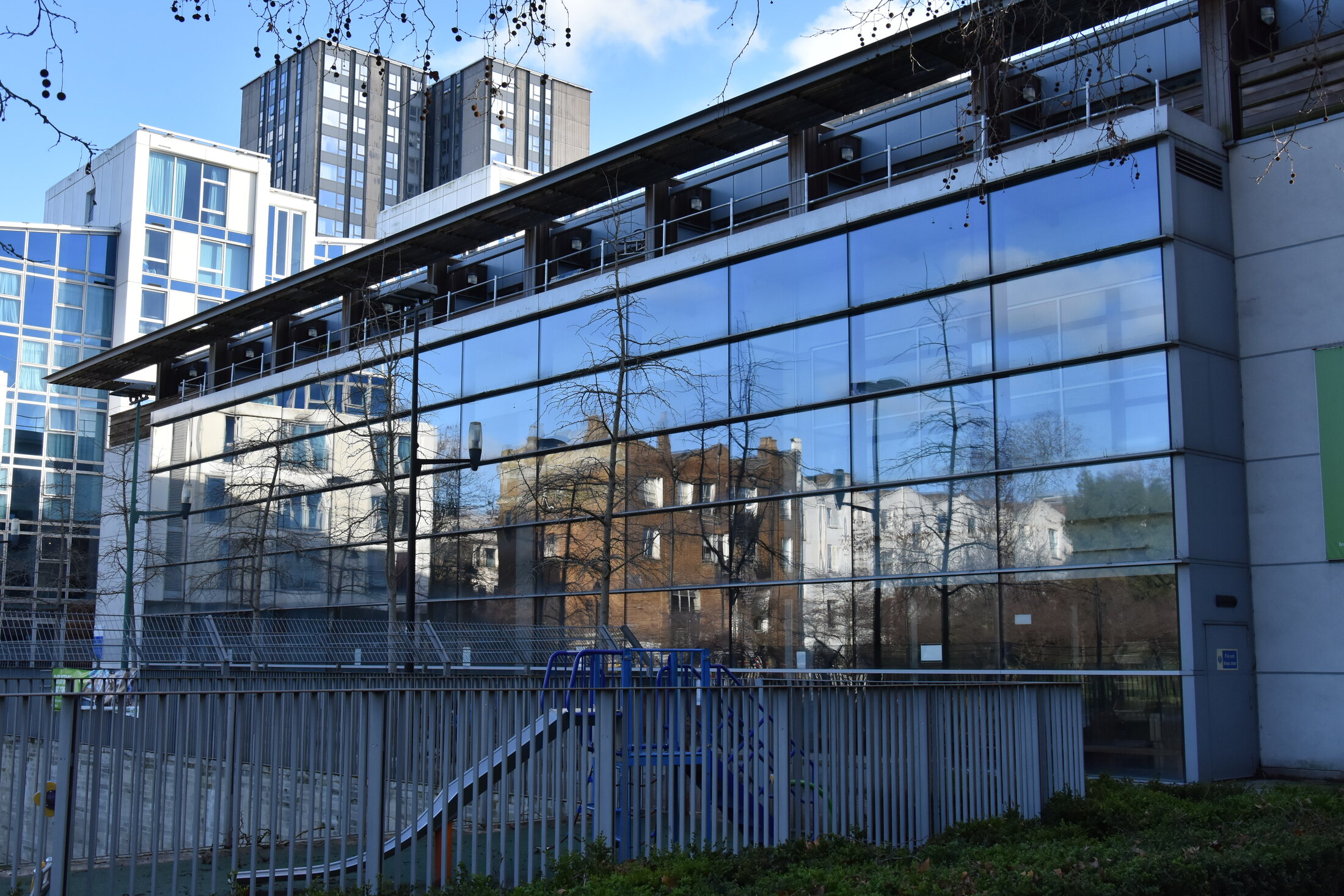 Modern glass frontage of Swiss Cottage Leisure Centre in London